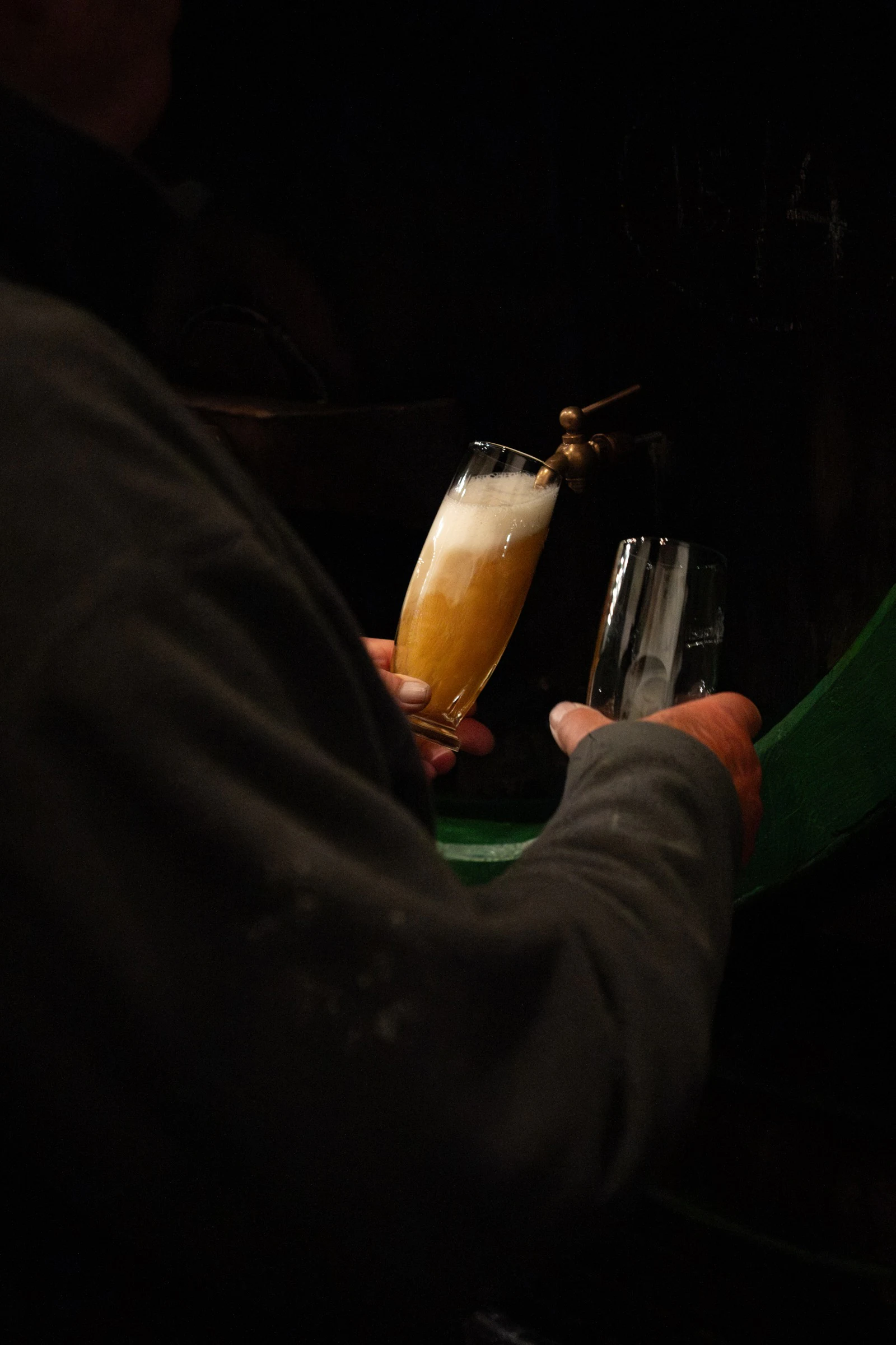 Beer glass in dark setting